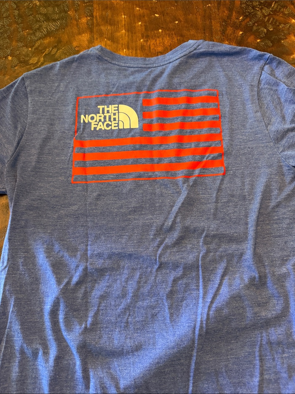 The North Face Kids Blue Tee with Red Flag Logo
